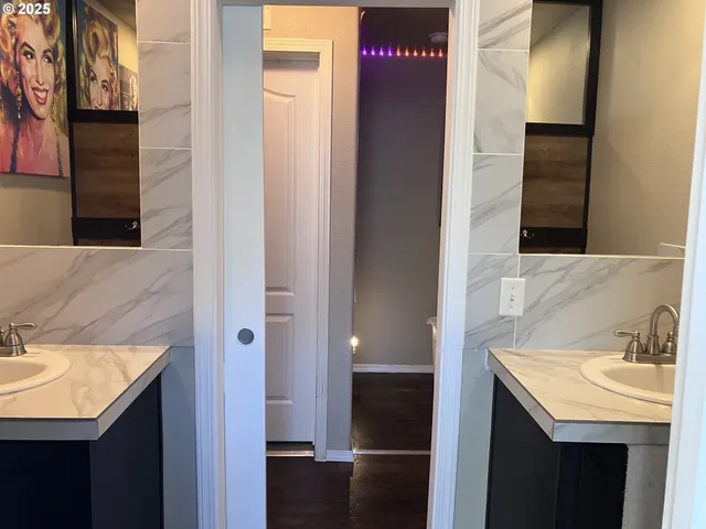 a bathroom with a sink and a mirror