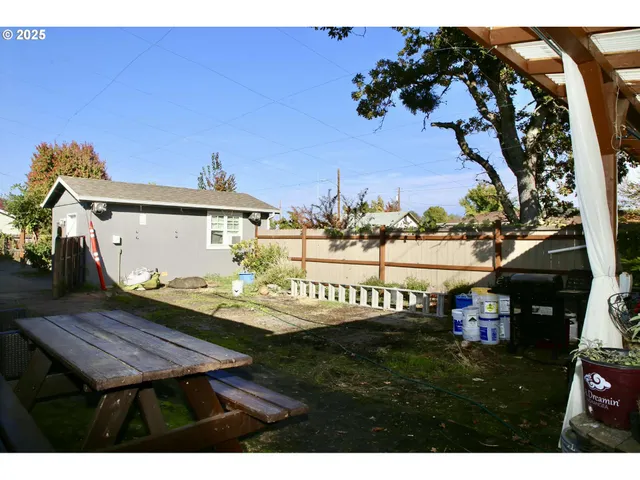 a view of a chairs and table on the wooden floor