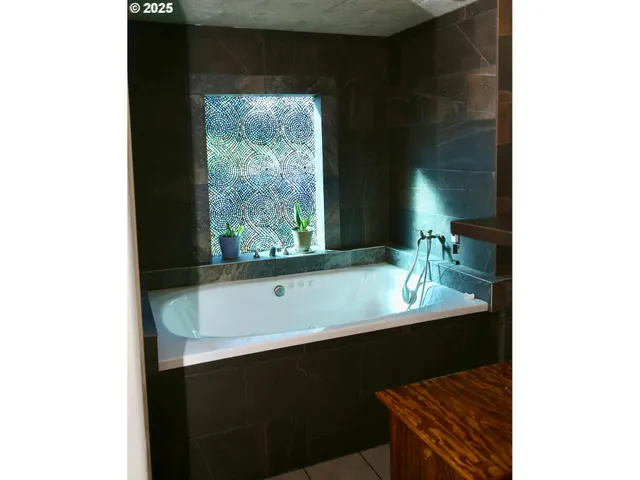 a bathroom with a sink and a window