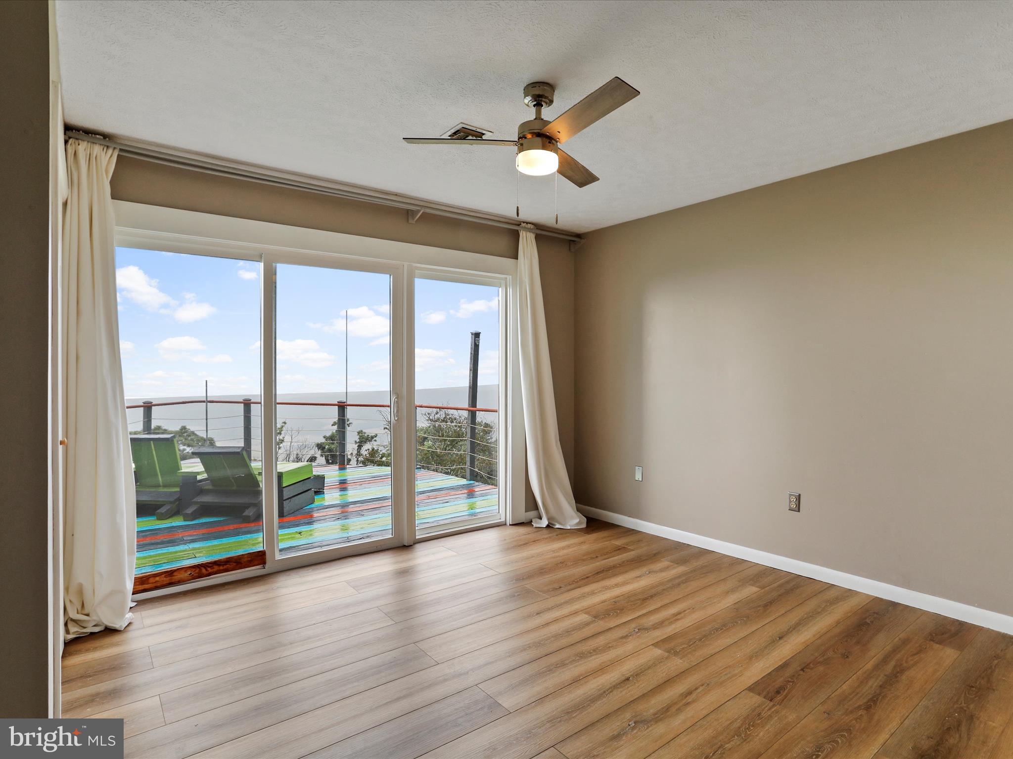 9475 Waxler Road Keyser, WV 26726 - Photo 21 of 61 wooden floor in an empty room with a window