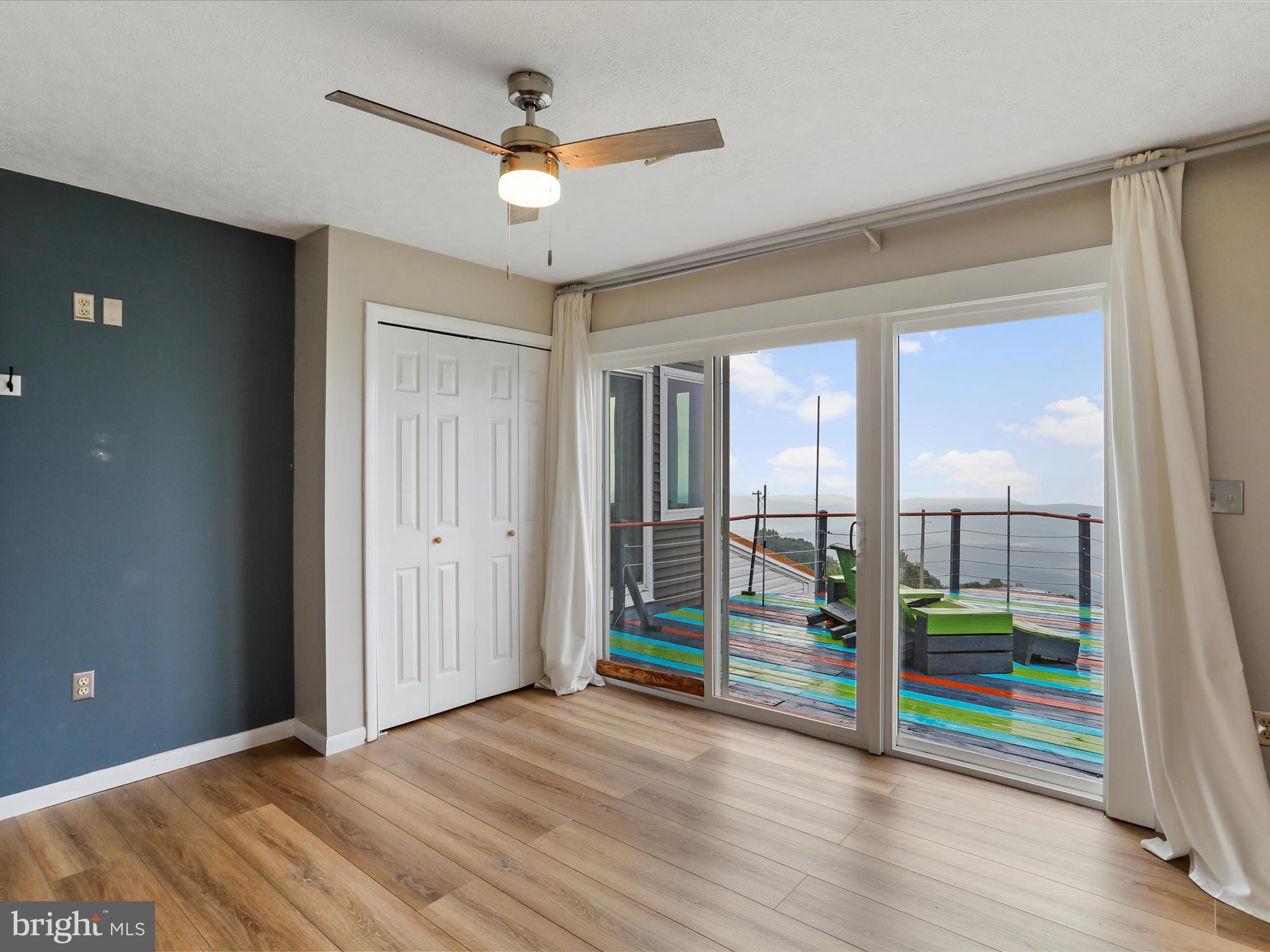 9475 Waxler Road Keyser, WV 26726 - Photo 22 of 61 an empty room with window and ceiling fan