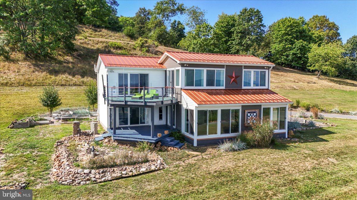 9475 Waxler Road Keyser, WV 26726 - Photo 3 of 61 a view of a house with a garden