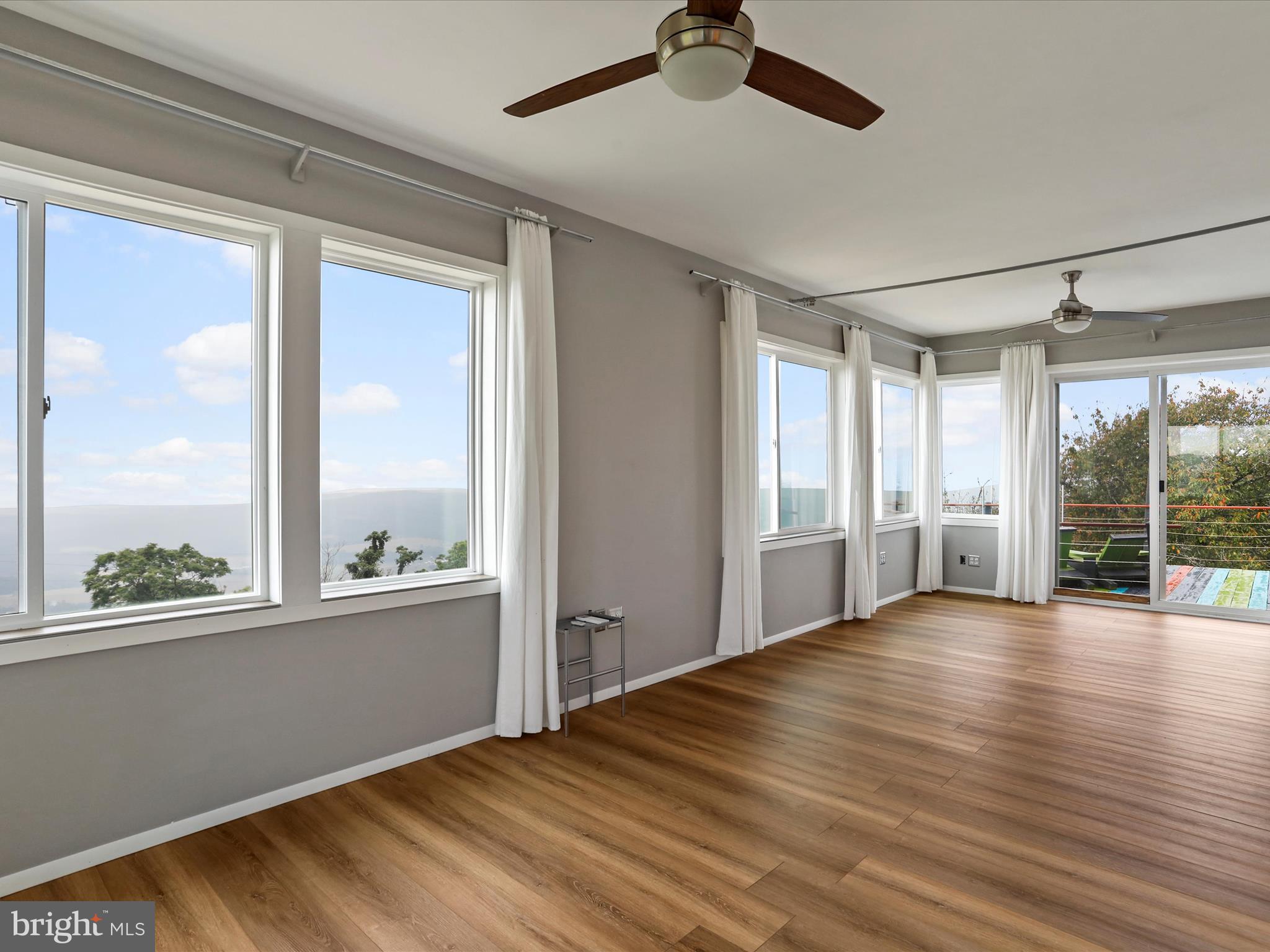 9475 Waxler Road Keyser, WV 26726 - Photo 33 of 61 a view of an empty room with a window and wooden floor