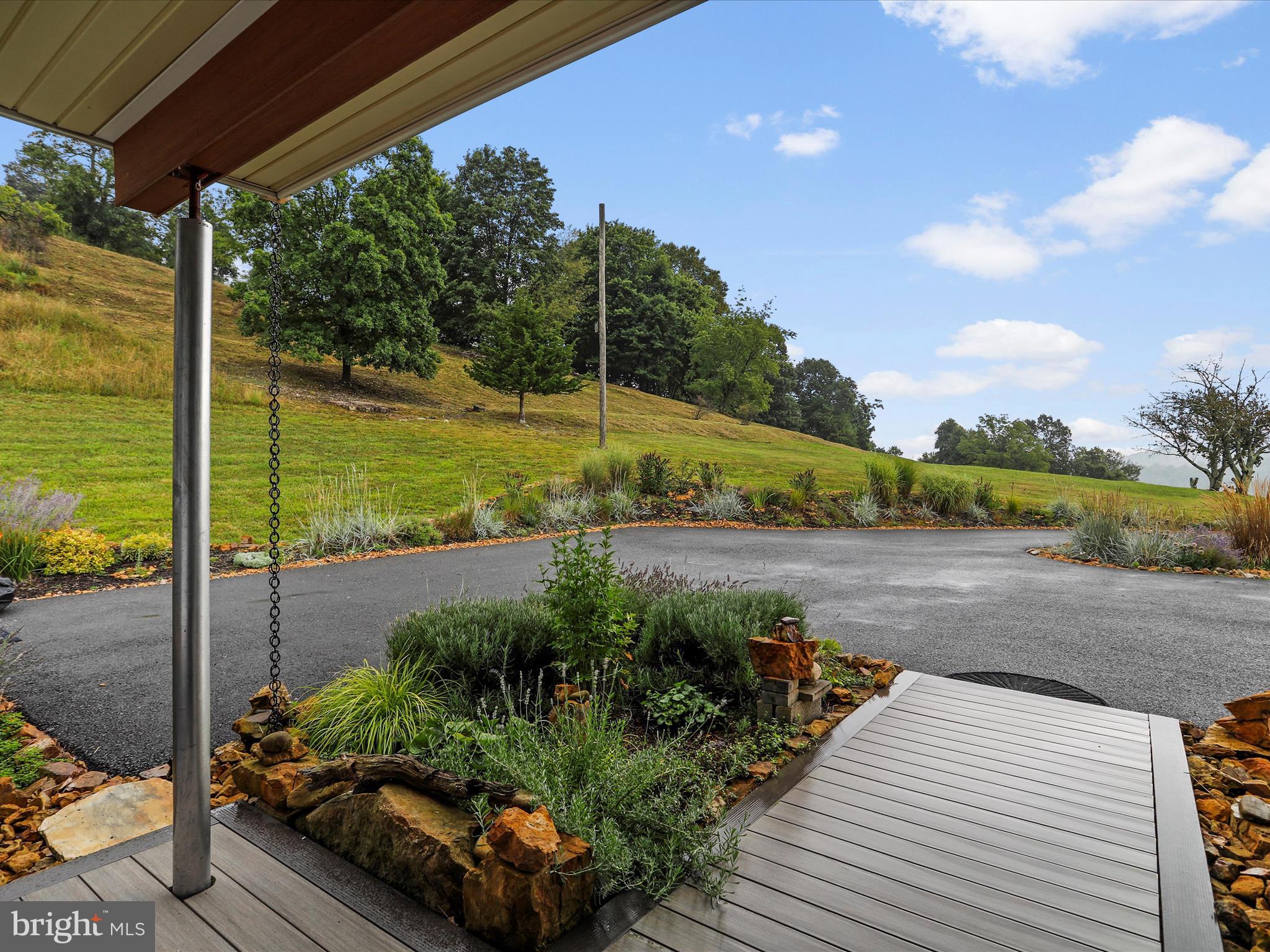 9475 Waxler Road Keyser, WV 26726 - Photo 46 of 61 a view of a garden with lawn chairs
