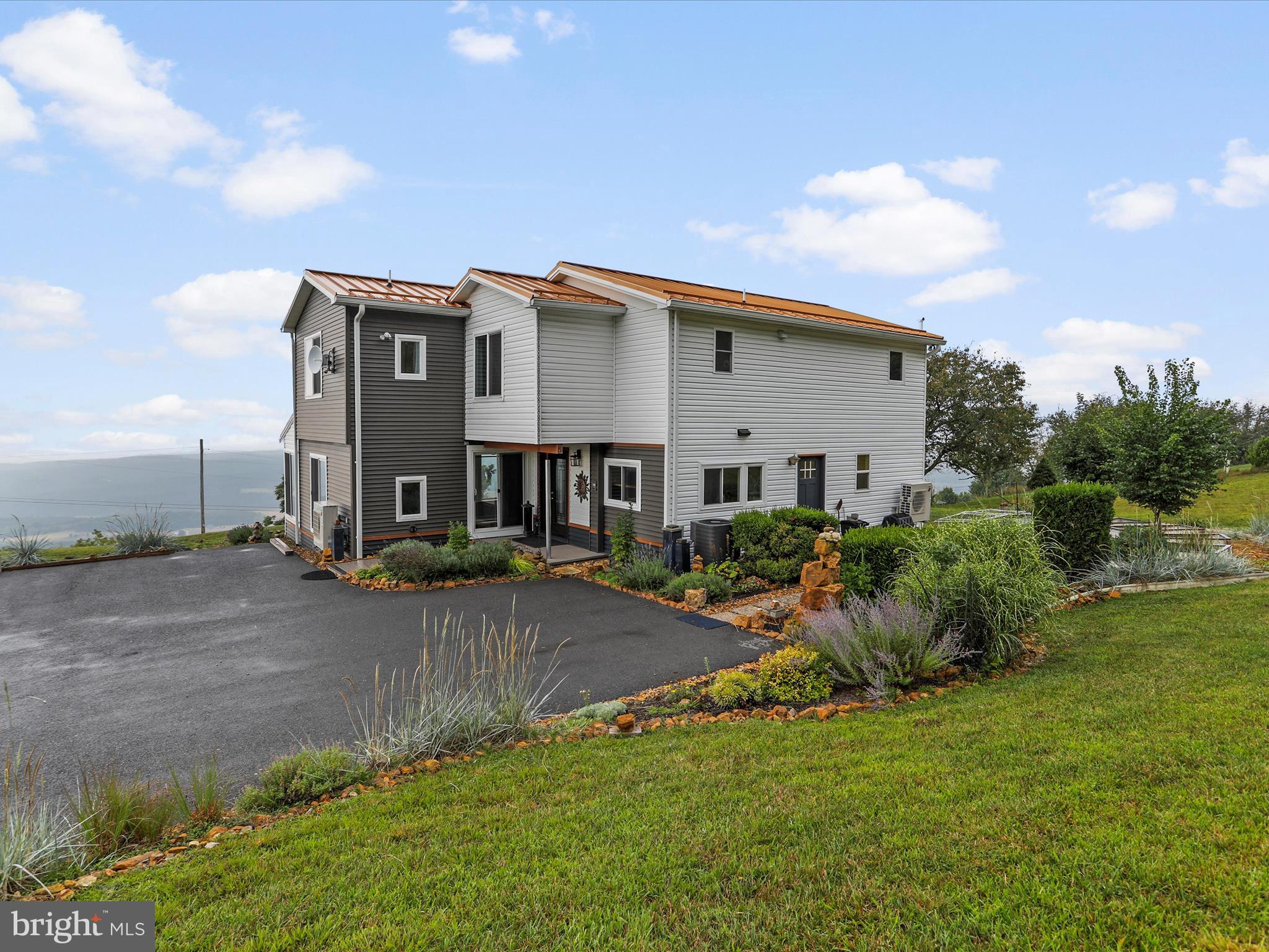 9475 Waxler Road Keyser, WV 26726 - Photo 47 of 61 a view of a house with a yard