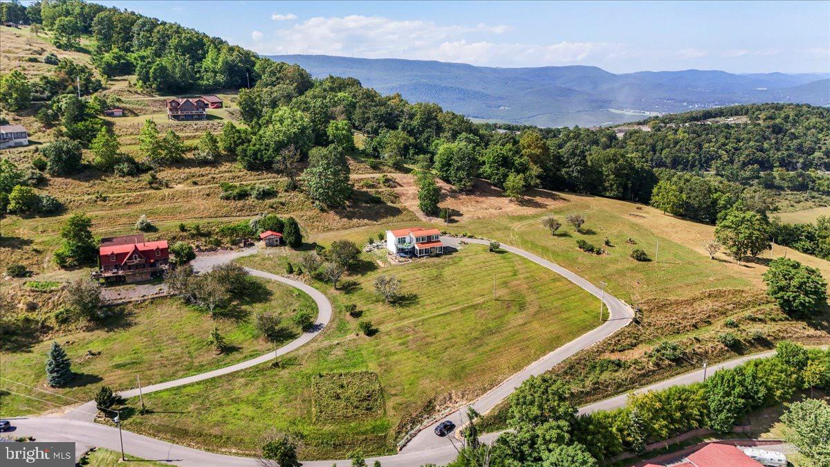 9475 Waxler Road Keyser, WV 26726 - Photo 51 of 61 a view of a swimming pool with a yard and mountain view in back