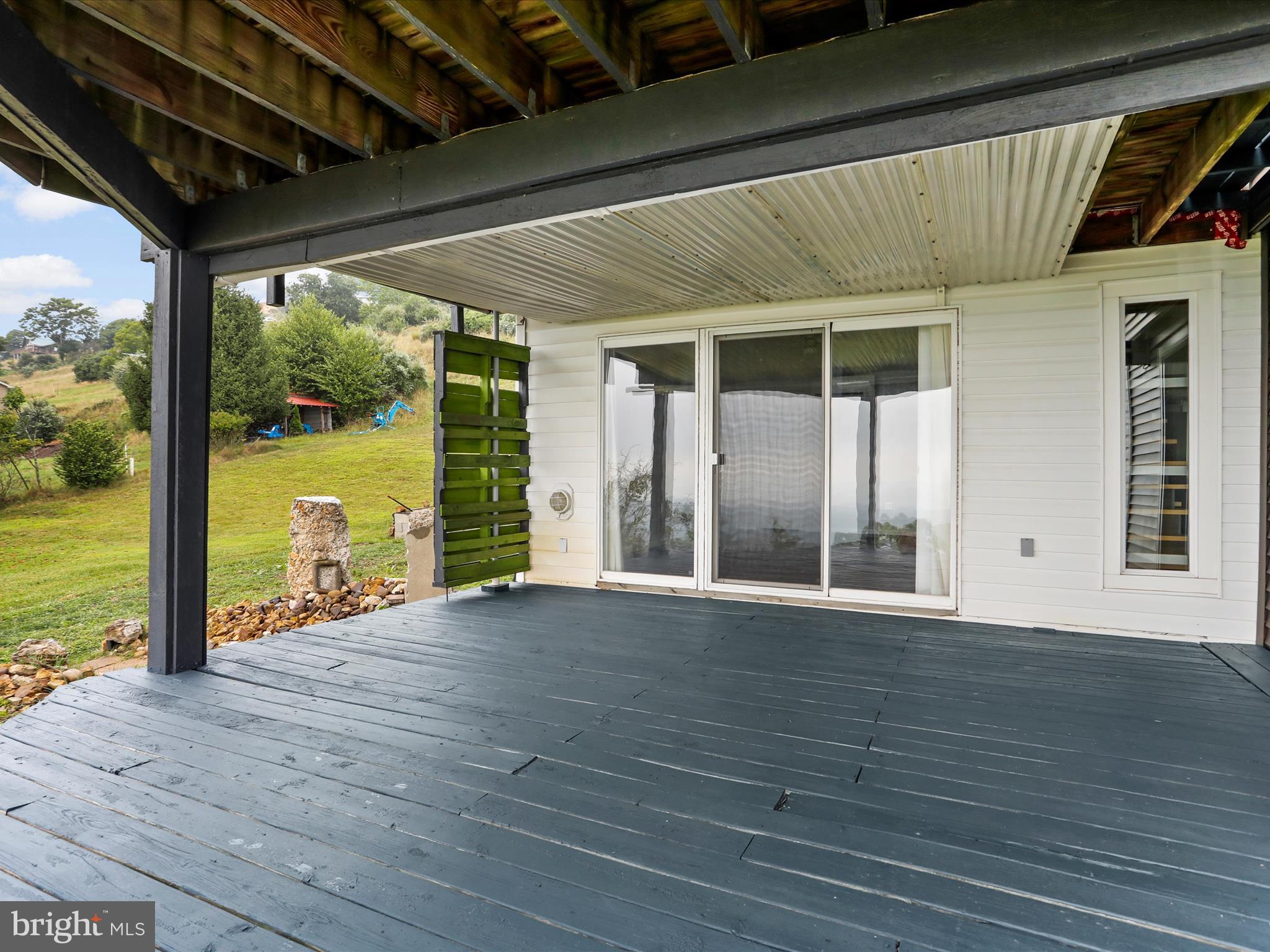 9475 Waxler Road Keyser, WV 26726 - Photo 60 of 61 a view of an empty room with wooden floor and a window