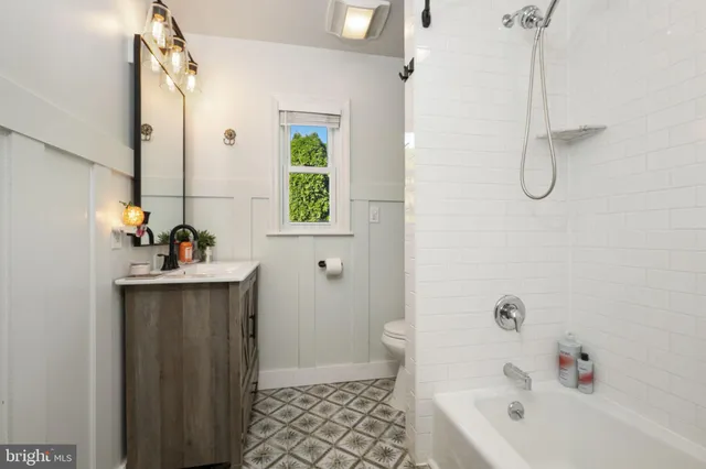a bath room with a sink and a tub