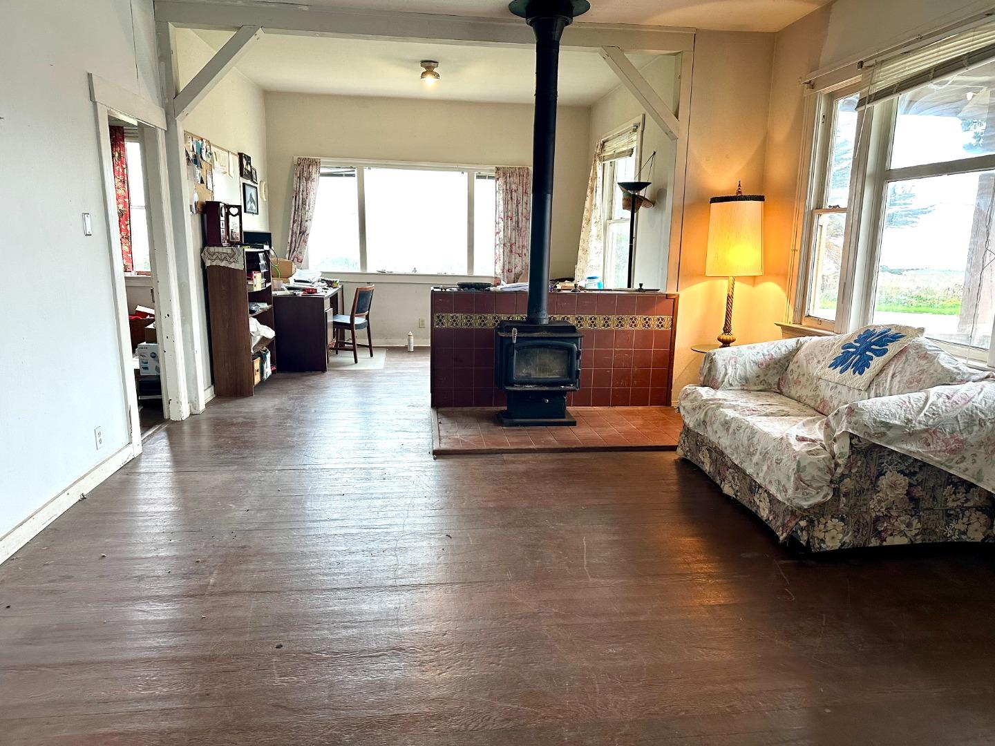 2 3rd Avenue Davenport, CA 95017 - Photo 17 of 19 a living room with furniture and large windows