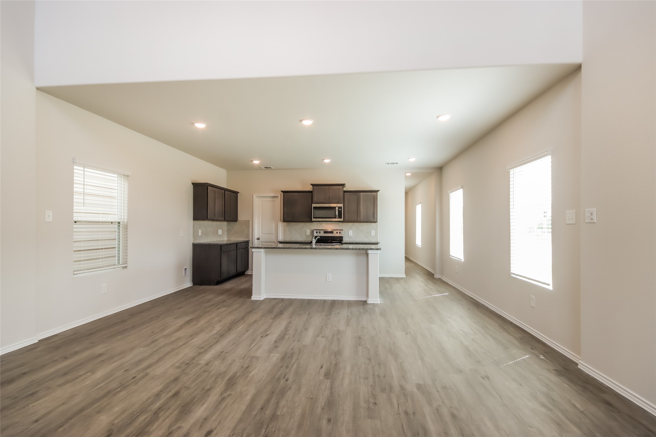 15226 Estrella Road West Houston, TX 77073 - Photo 5 of 13 a view of kitchen with refrigerator sink and microwave