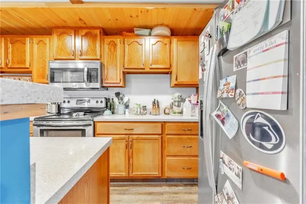 a kitchen with stainless steel appliances granite countertop a sink and cabinets