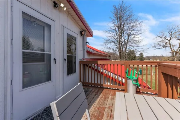 a kitchen with stainless steel appliances kitchen island granite countertop a stove a sink and a refrigerator with wooden floor