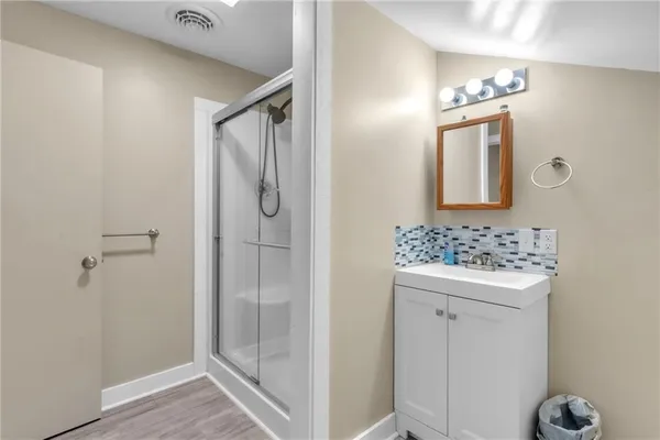 a bathroom with a bathtub and a shower