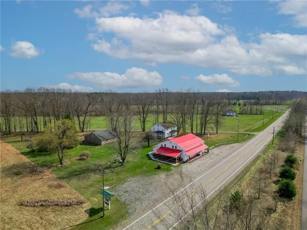 a view of a yard with furniture and outdoor view
