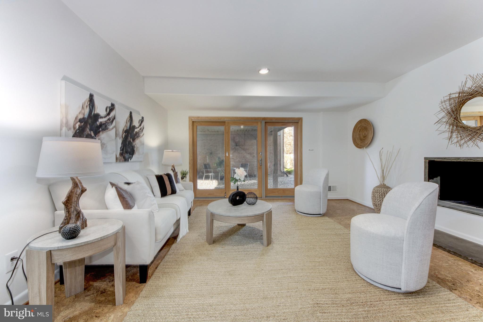 5814 MacArthur Boulevard Northwest Washington, DC 20016 - Photo 16 of 31 Lower level family room with doors to