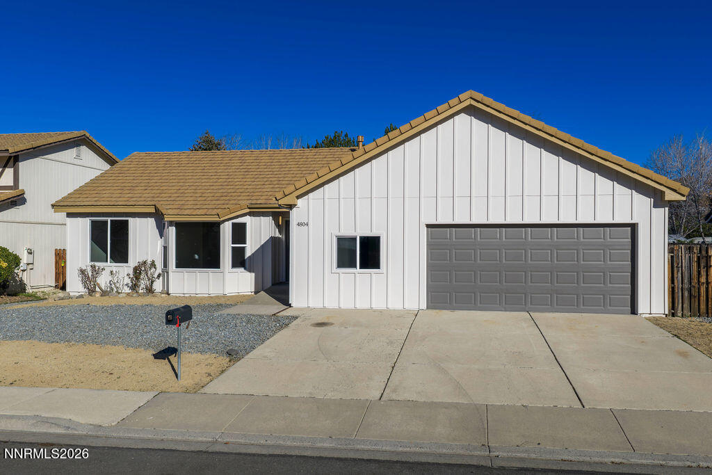 4804 Pinesprings Drive Reno, NV 89509 - Photo 28 of 32 a backyard of a house with yard and garage