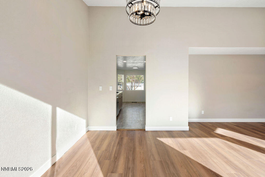 4804 Pinesprings Drive Reno, NV 89509 - Photo 7 of 32 a view of empty room with wooden floor