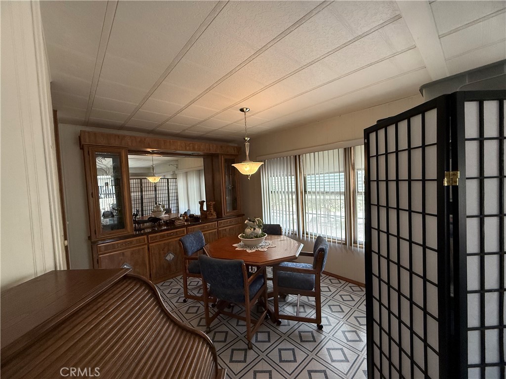 4878 Leonard Road, Unit 11 Mariposa, CA 95338 - Photo 11 of 15 a view of a dining room with furniture window and outside view