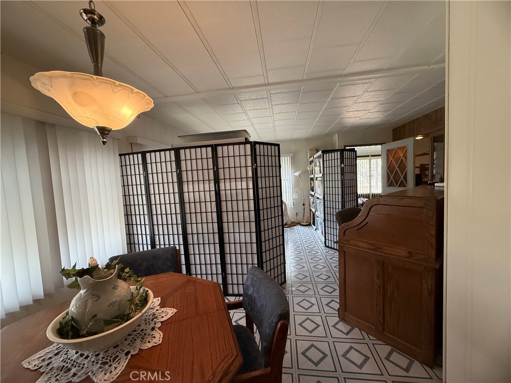 4878 Leonard Road, Unit 11 Mariposa, CA 95338 - Photo 13 of 15 a living room with furniture and a chandelier