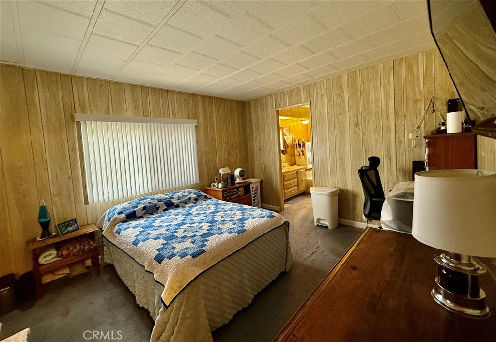 4878 Leonard Road, Unit 11 Mariposa, CA 95338 - Photo 8 of 15 a bedroom with bed and a window