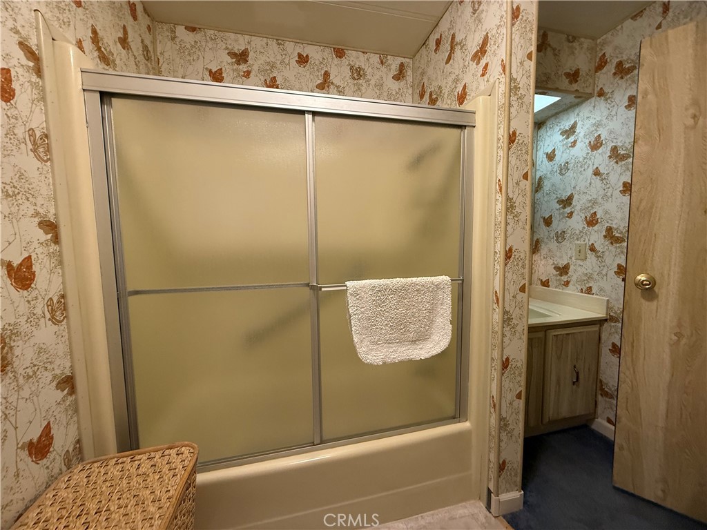 4878 Leonard Road, Unit 11 Mariposa, CA 95338 - Photo 10 of 15 a bathroom with a shower and a sink