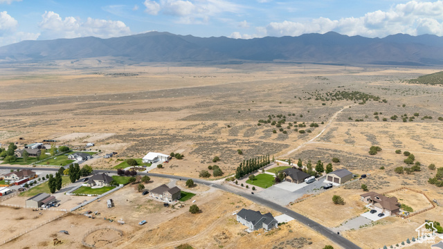 2974 West Ridgeline Road, Unit 85 Stockton, UT 84071 - Photo 19 of 23 Aerial overview of property's location featuring a mountainous background and rural landscape