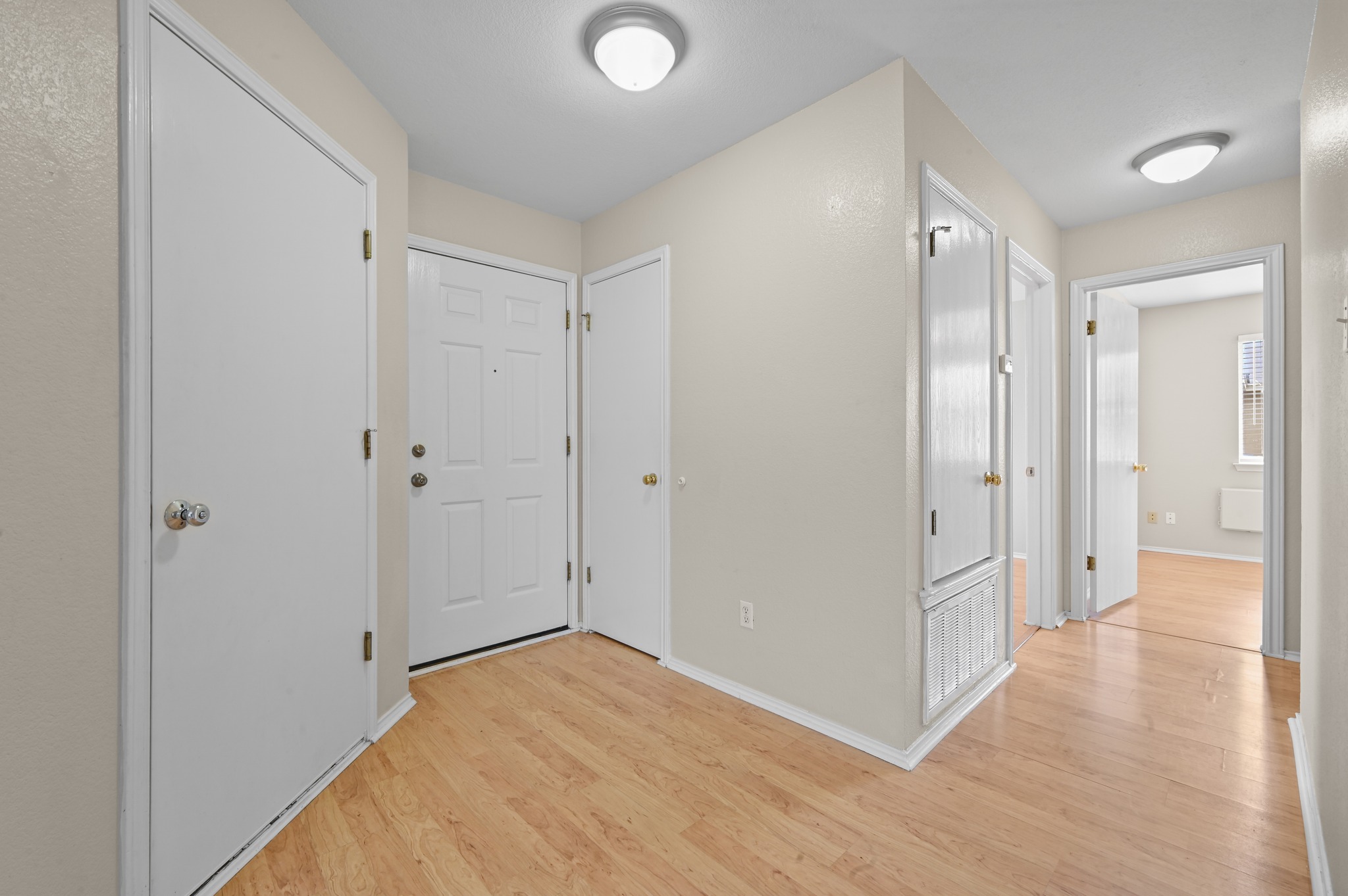 112 Mason Reed Cove Kyle, TX 78640 - Photo 5 of 26 a view of a hallway with wooden floor