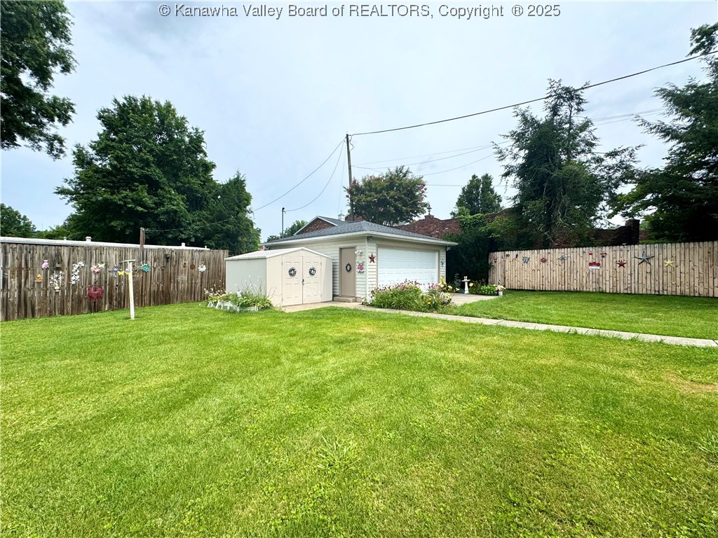 1425 Strawberry Road St. Albans, WV 25177 - Photo 18 of 43 Privacy Fence Backyard with detached garage and storage building