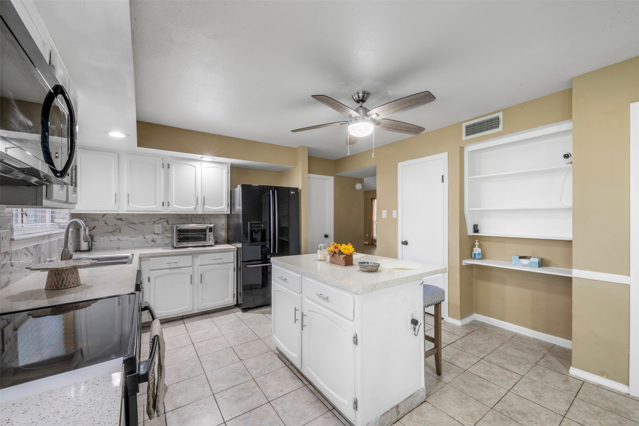 25306 Mill Pond Lane Spring, TX 77373 - Photo 15 of 37 a kitchen with a sink cabinets and window