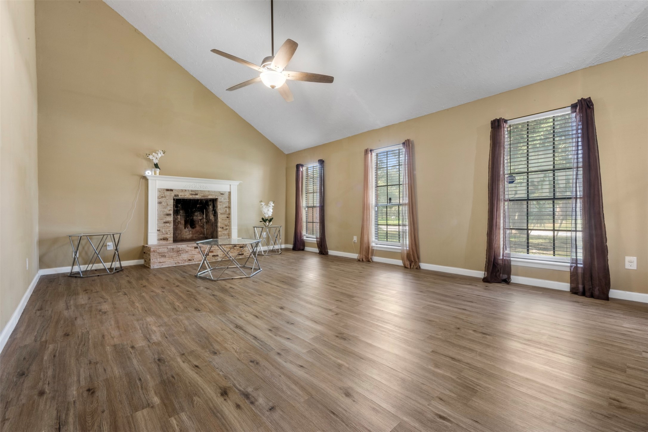 25306 Mill Pond Lane Spring, TX 77373 - Photo 4 of 37 a view of a livingroom with wooden floor and a ceiling fan