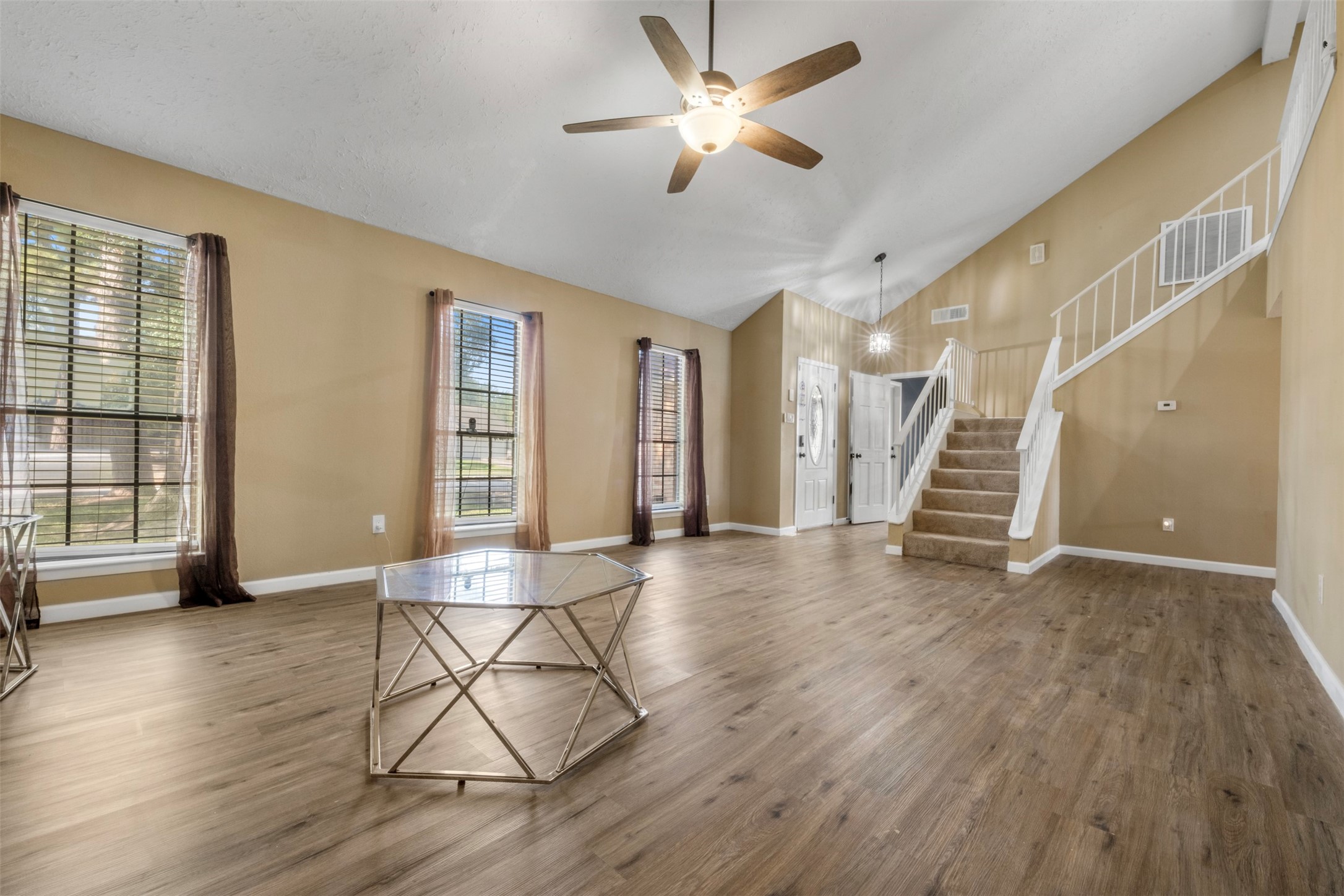 25306 Mill Pond Lane Spring, TX 77373 - Photo 6 of 37 a view of an empty room with wooden floor and a window