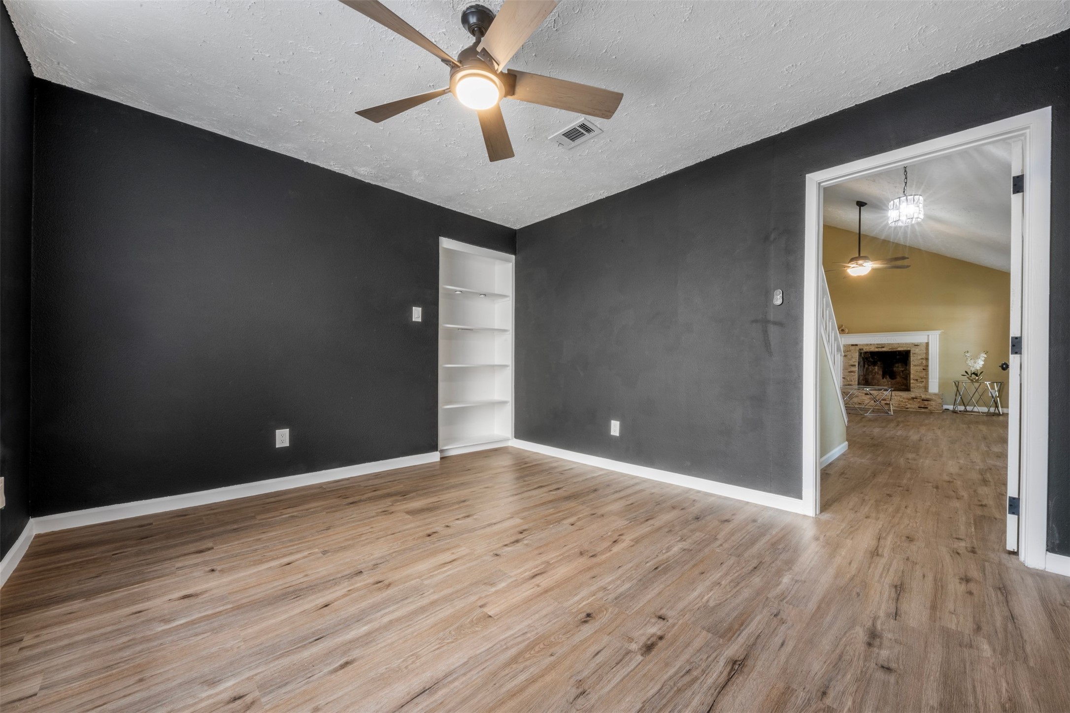 25306 Mill Pond Lane Spring, TX 77373 - Photo 8 of 37 wooden floor in an empty room with a fan