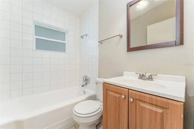 a bathroom with a sink a toilet and bathtub