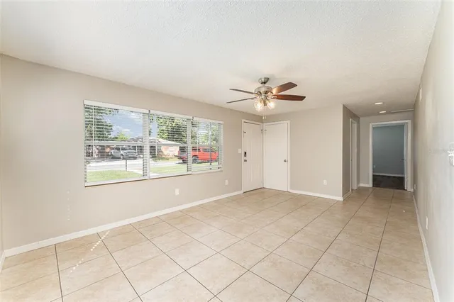 a view of an empty room with a window