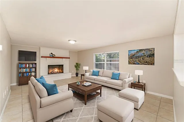 a living room with furniture and a fireplace
