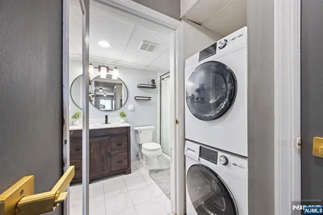 a view of a hallway with washer and dryer