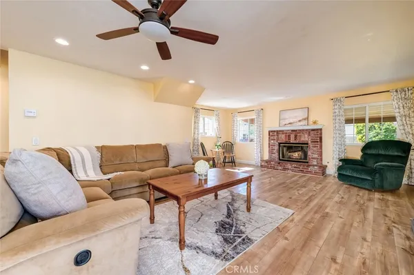 a living room with furniture and a fireplace