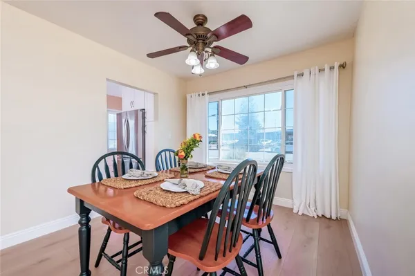 a view of a dining room with furniture window and wooden floor