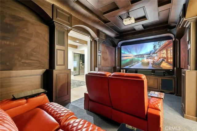 a living room with furniture flowers and a rug