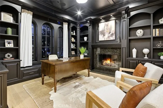 a room with furniture pool table and windows