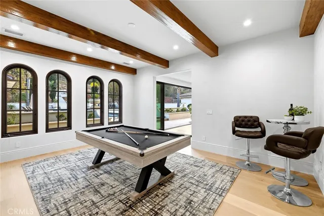 a living room with furniture a rug and a large window