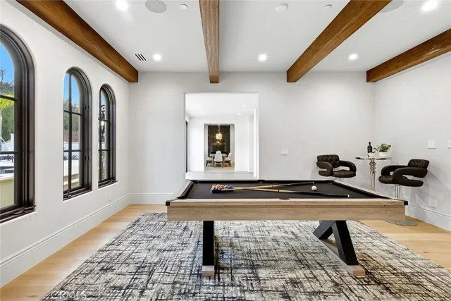 a spacious bedroom with a large bed and a fireplace