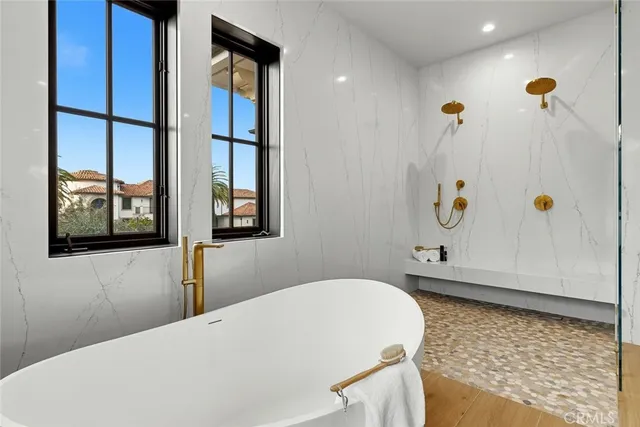 a room with a table chairs and a kitchen view