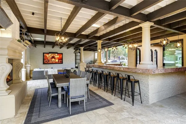 a front view of a house with garden and trees