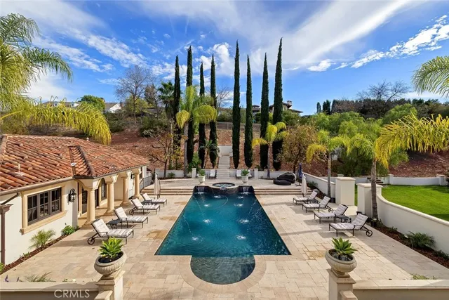 an aerial view of multiple houses with a yard