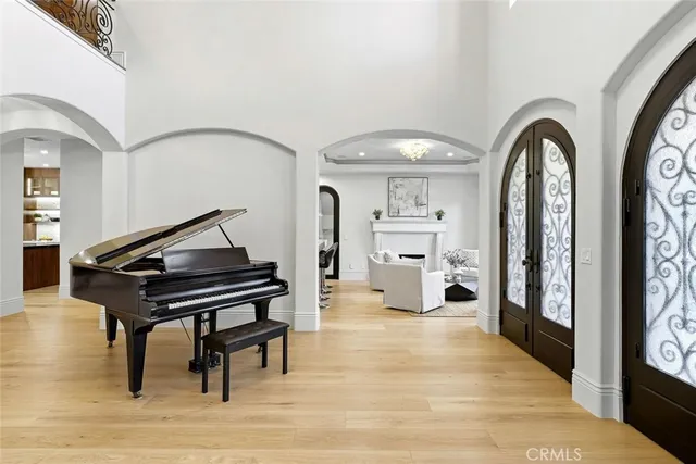 a kitchen with stainless steel appliances granite countertop a stove a sink and a chandelier