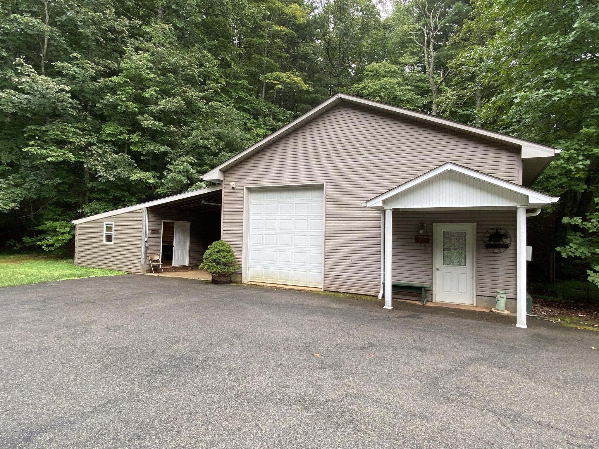 5378 Ferrum Mountain Road Callaway, VA 24067 - Photo 22 of 71 a view of a house with a yard and garage