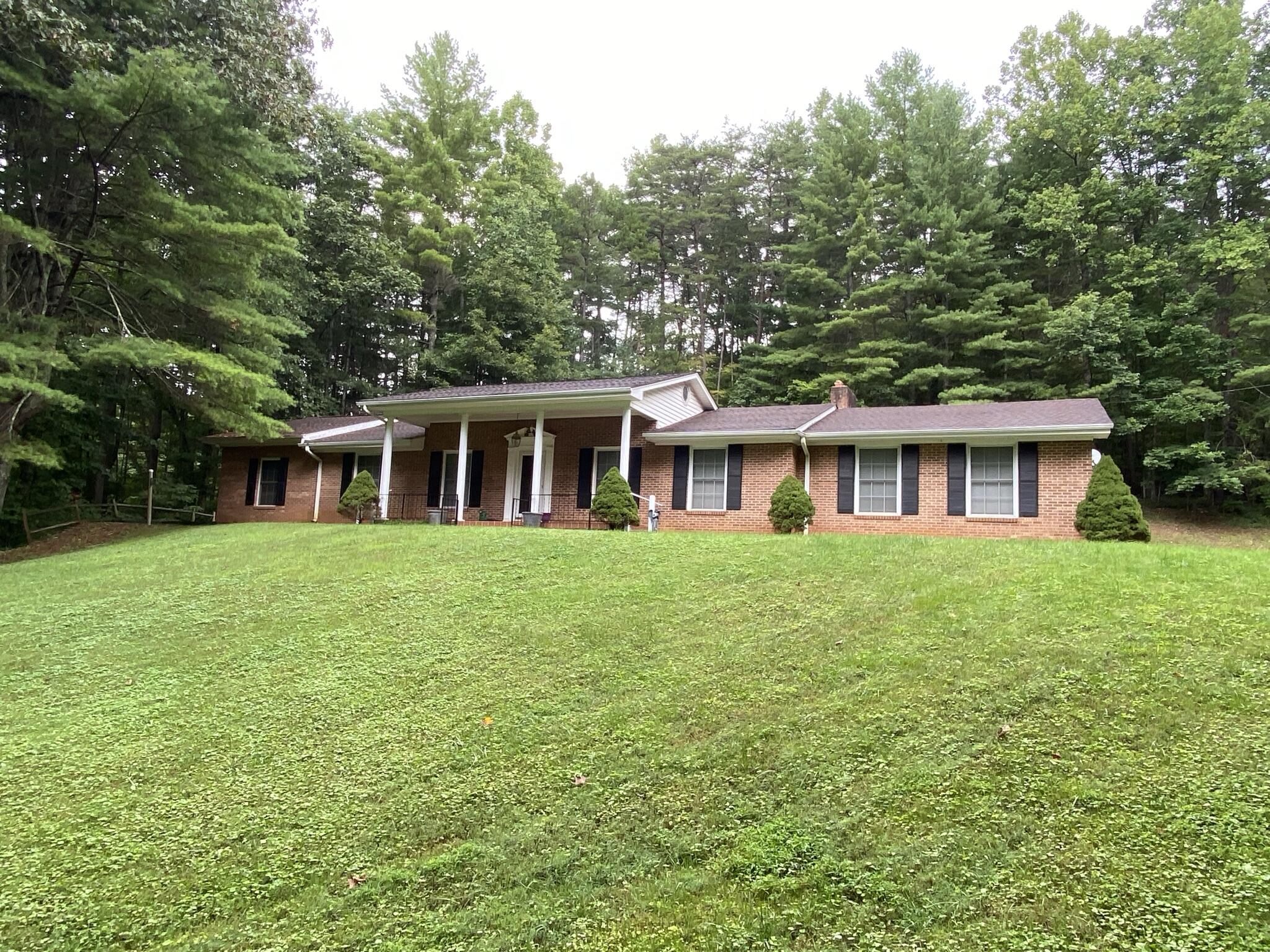 5378 Ferrum Mountain Road Callaway, VA 24067 - Photo 36 of 71 a front view of a house with a garden