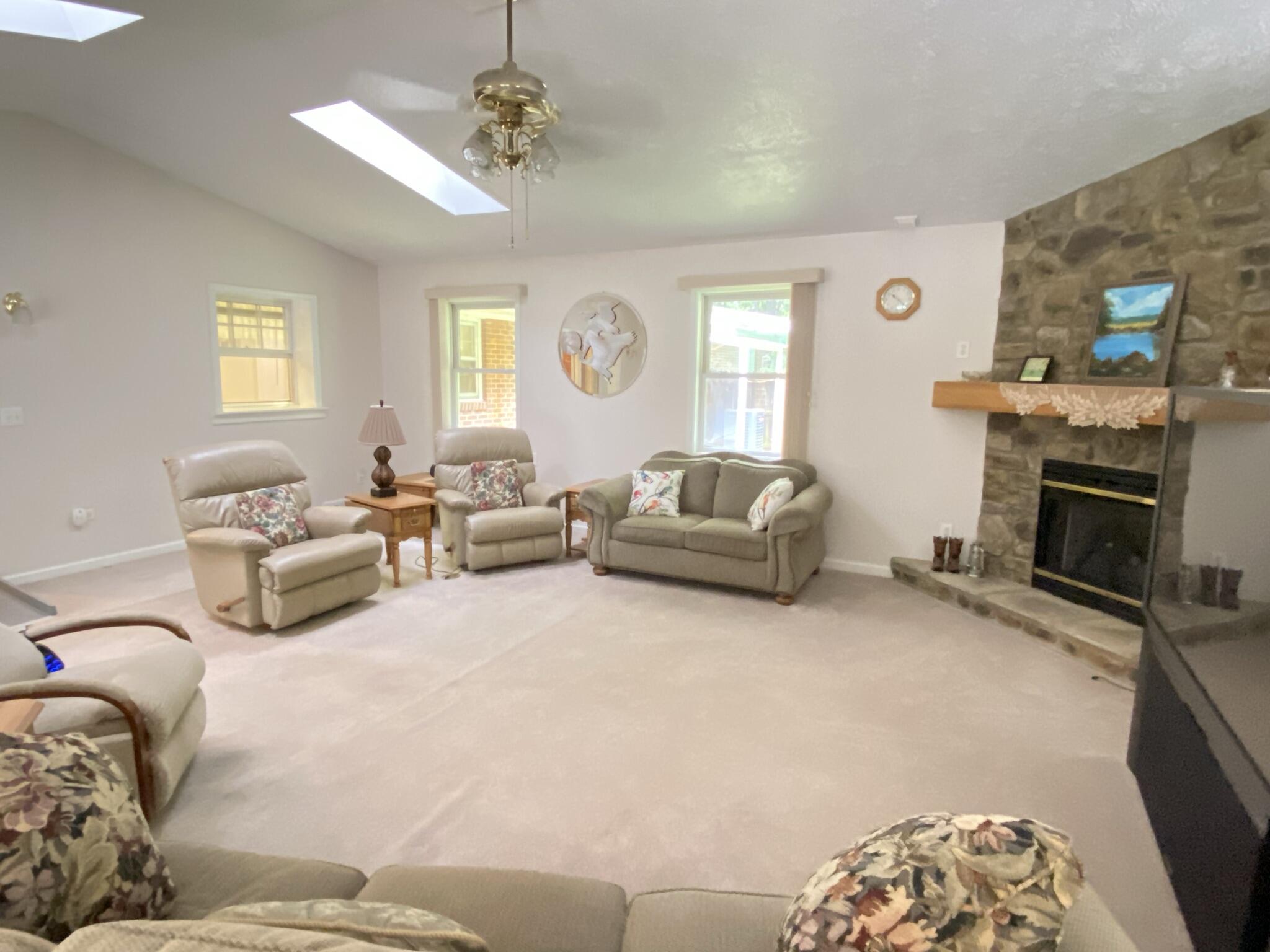 5378 Ferrum Mountain Road Callaway, VA 24067 - Photo 37 of 71 a living room with furniture a fireplace and a window