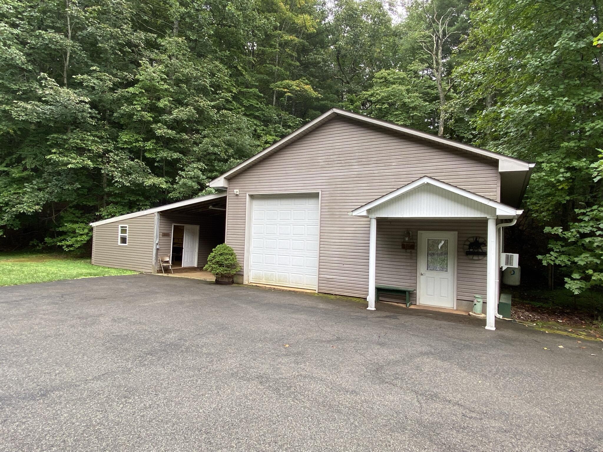 5378 Ferrum Mountain Road Callaway, VA 24067 - Photo 58 of 71 a view of a house with a yard and garage